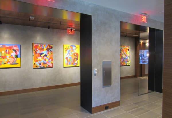 Gallery corridor at The Signature in Reston with spatulata plaster walls and Koncrete columns