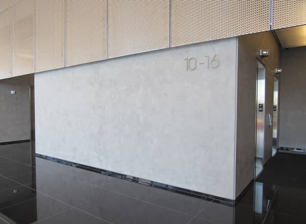 Lobby corridor at Reston Station with a spatulata-textured plaster wall
